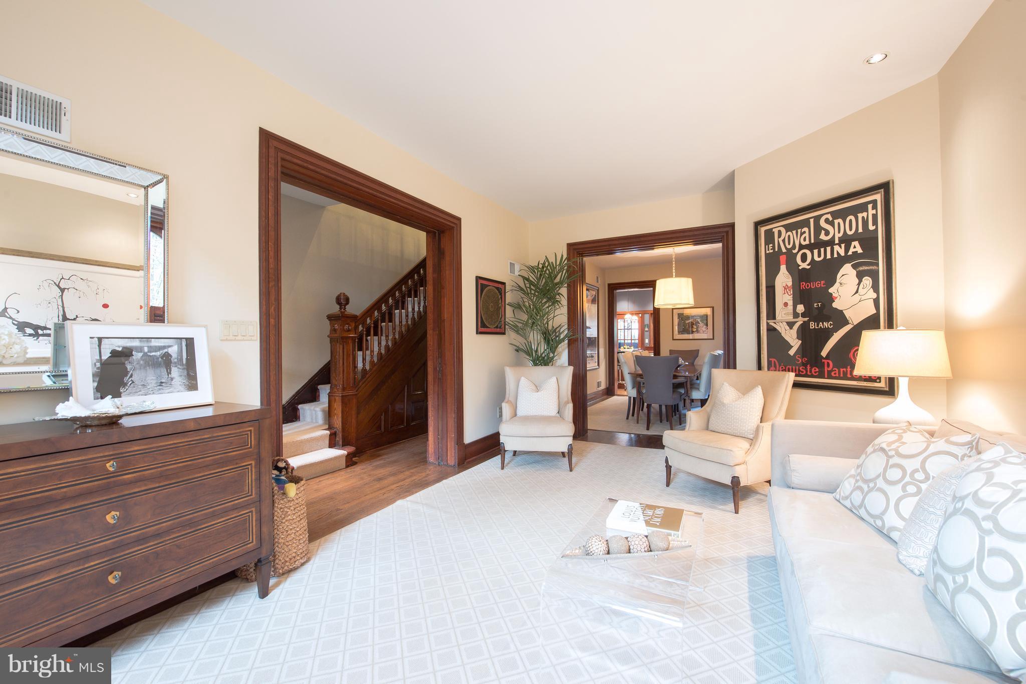 1016 Massachusetts Avenue Northeast Washington, DC 20002 - Photo 4 of 28 a living room with furniture and a mirror