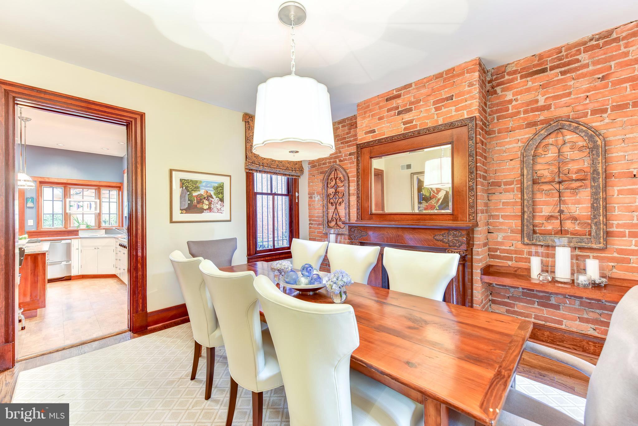 1016 Massachusetts Avenue Northeast Washington, DC 20002 - Photo 6 of 28 a view of a dining room with furniture a chandelier and wooden floor