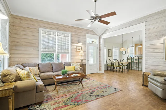 a dining room filled with furniture and wooden floor