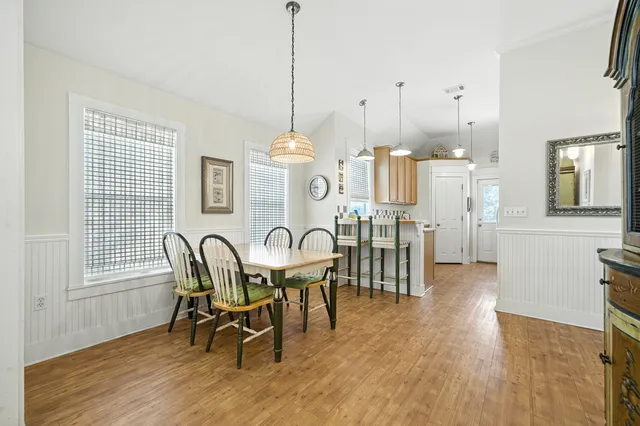 a very nice looking room with a large window and chandelier