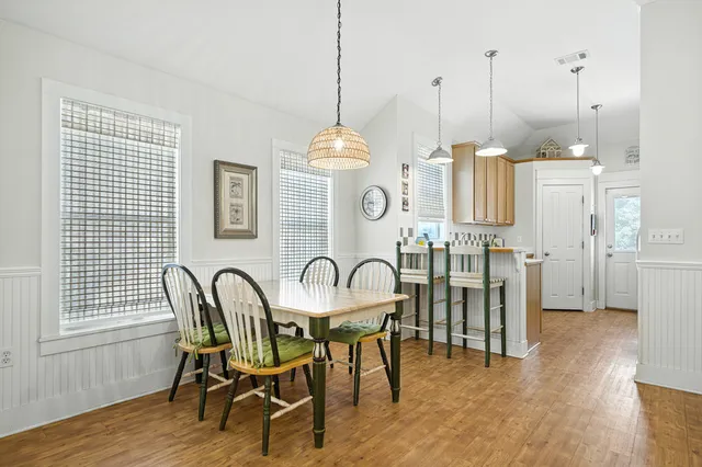 a kitchen with cabinets appliances and a sink