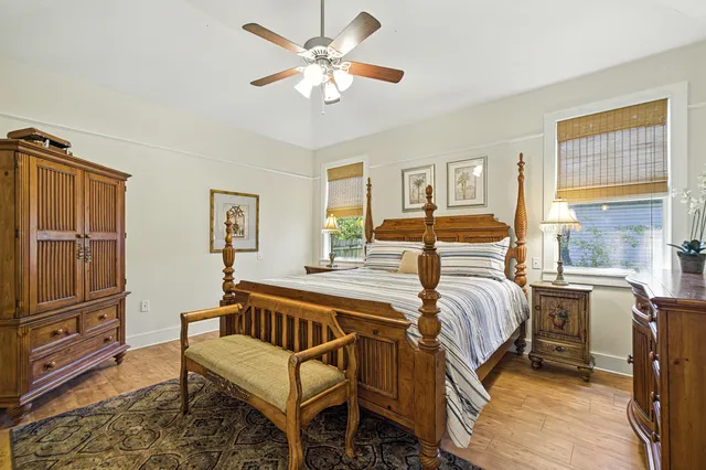 a bathroom with a granite countertop sink toilet a mirror and shower