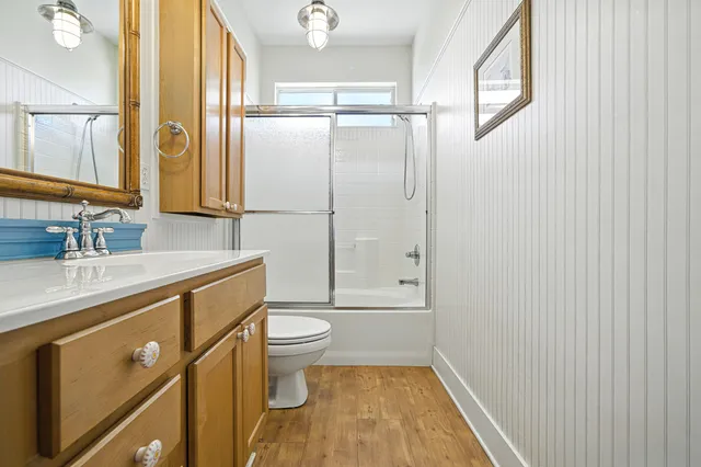 a bed room with a bed and a chandelier