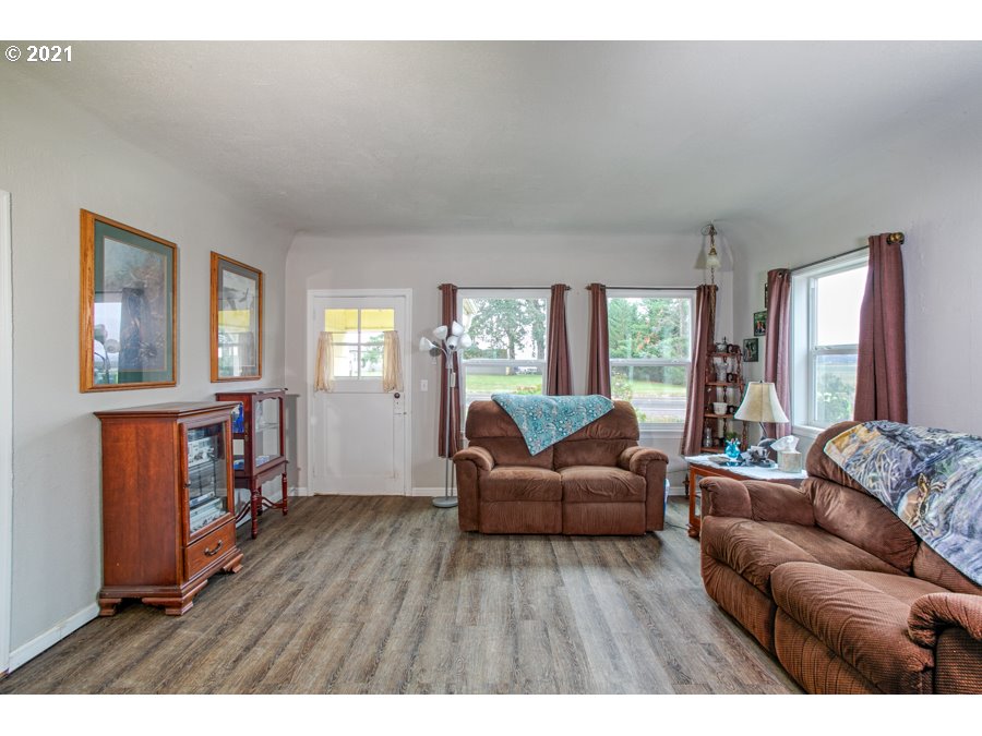 7701 Howell Prairie Road Northeast Silverton, OR 97381 - Photo 5 of 19 a living room with furniture and a wooden floor