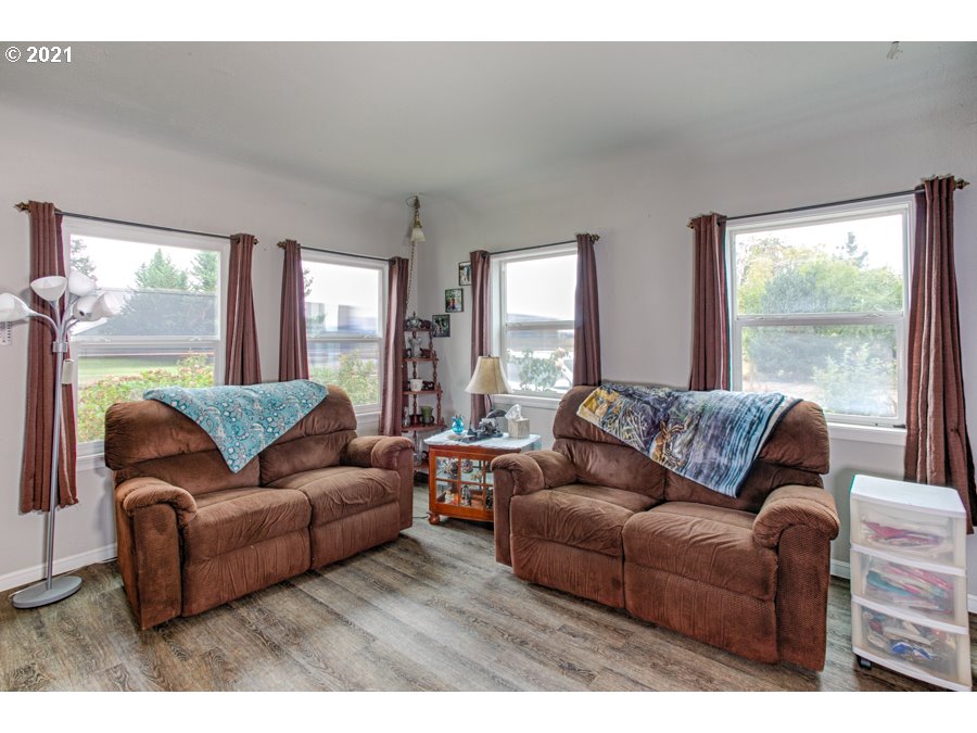 7701 Howell Prairie Road Northeast Silverton, OR 97381 - Photo 6 of 19 a living room with furniture and a large window