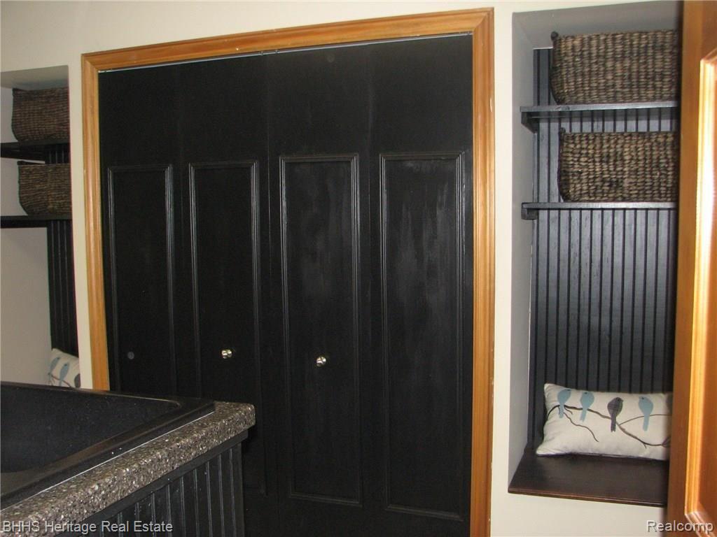 8756 McClements Road Brighton, MI 48114 - Photo 24 of 42 Laundry Room Sink & Bench