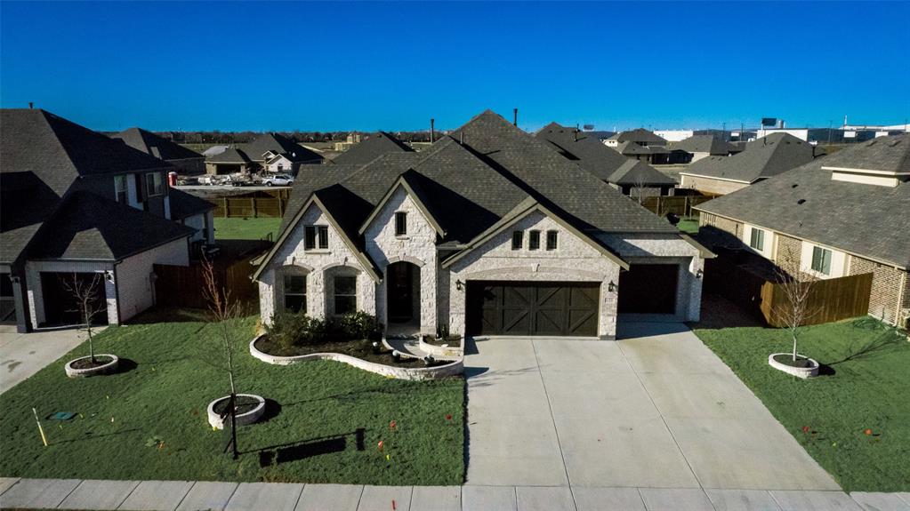a view of a big house with a big yard