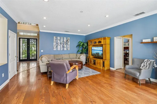 a living room with furniture a fireplace and a window