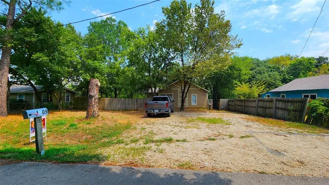 a swimming pool with some trees in the background
