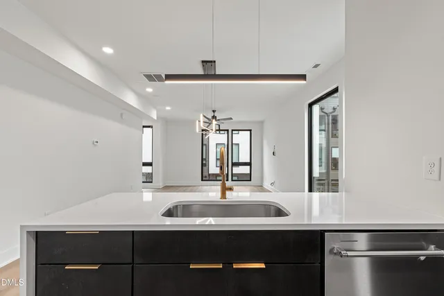 a kitchen with a sink and a refrigerator
