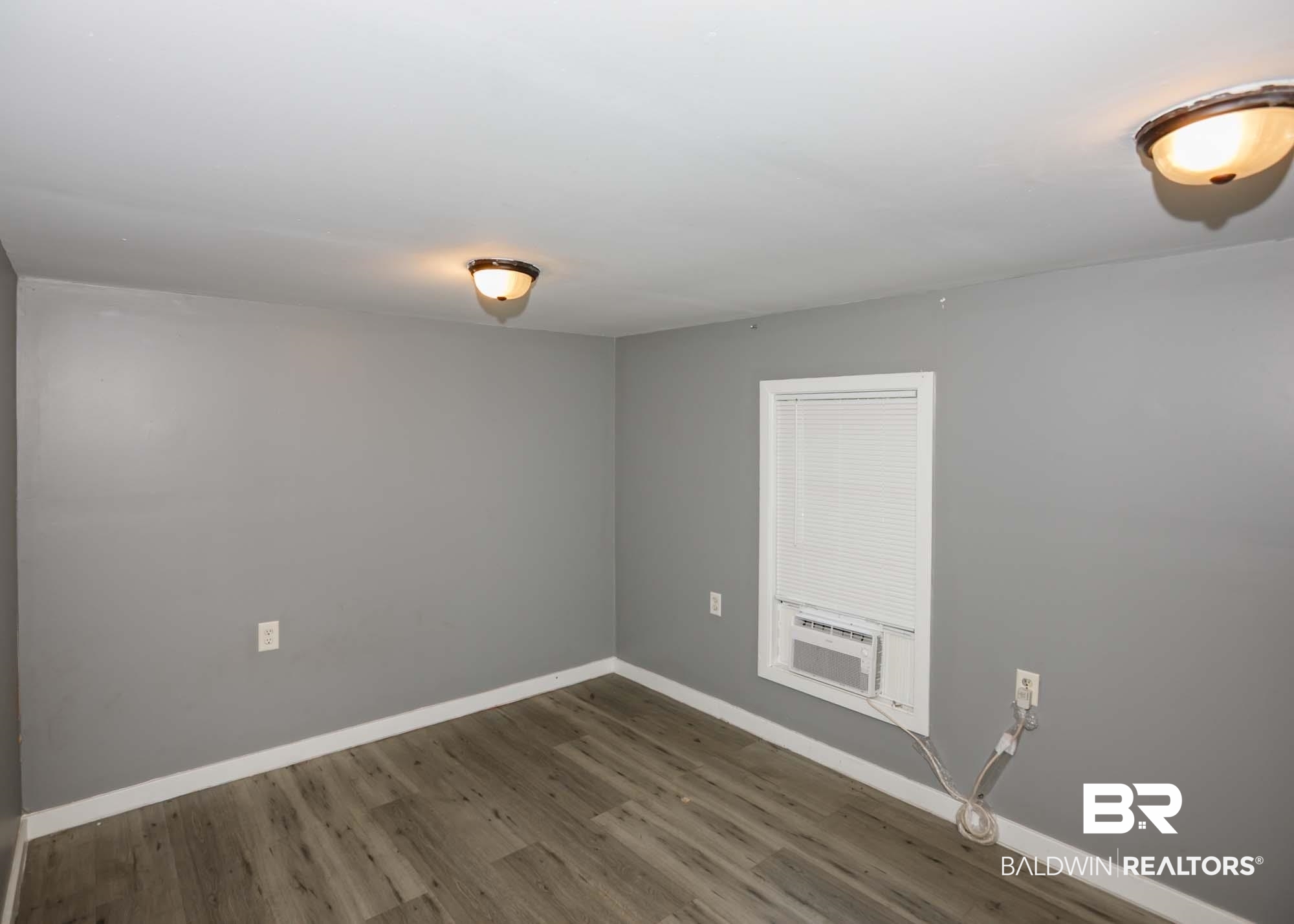 11998 Workman Avenue Foley, AL 36535 - Photo 50 of 59 Unfurnished room featuring wood finished floors and baseboards