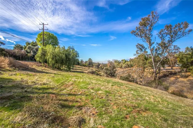 a view of a street with a building in the background