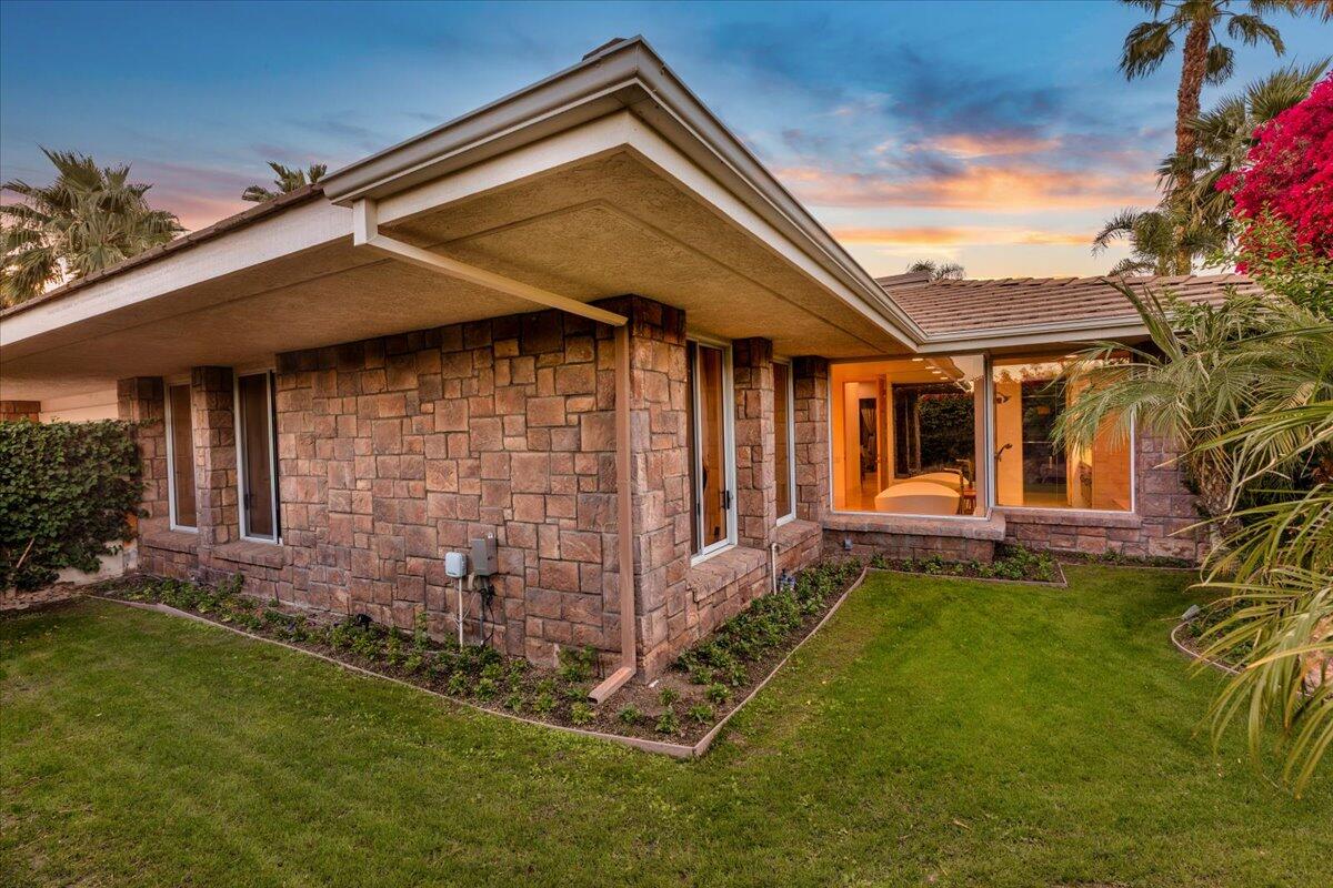 2 Deerfield Court Rancho Mirage, CA 92270 - Photo 102 of 104 a backyard of a house with table and chairs