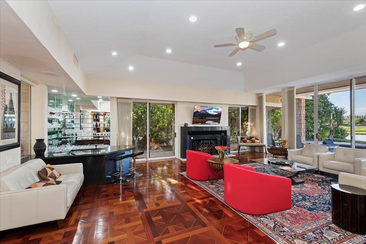 2 Deerfield Court Rancho Mirage, CA 92270 - Photo 25 of 104 a living room with furniture a rug and a flat screen tv