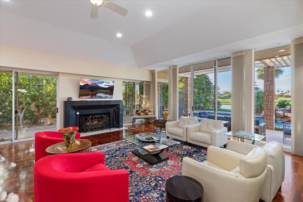 2 Deerfield Court Rancho Mirage, CA 92270 - Photo 27 of 104 a living room with furniture fireplace and a large window