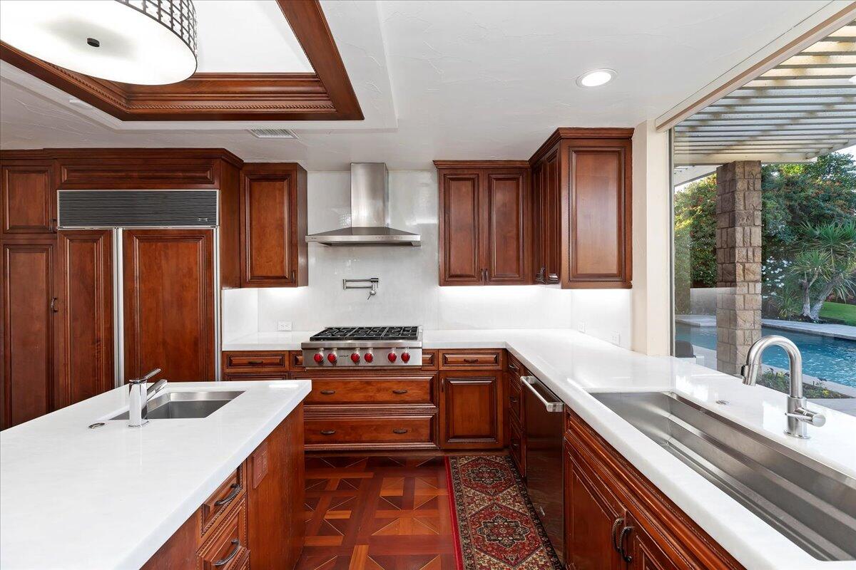 2 Deerfield Court Rancho Mirage, CA 92270 - Photo 37 of 104 a kitchen with a stove a sink and a cabinets