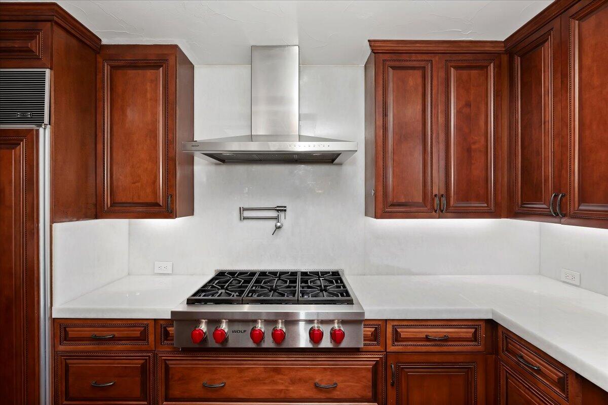 2 Deerfield Court Rancho Mirage, CA 92270 - Photo 38 of 104 a kitchen with granite countertop a stove and a cabinet