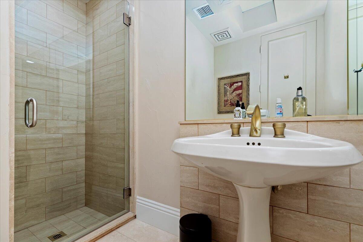 2 Deerfield Court Rancho Mirage, CA 92270 - Photo 47 of 104 a bathroom with a sink and a mirror