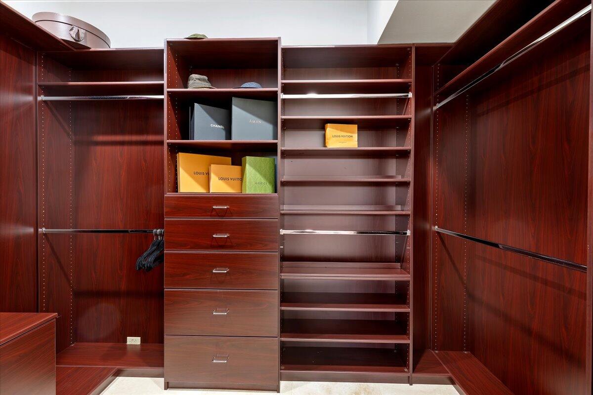 2 Deerfield Court Rancho Mirage, CA 92270 - Photo 64 of 104 a view of walk in closet with clothes and shoes
