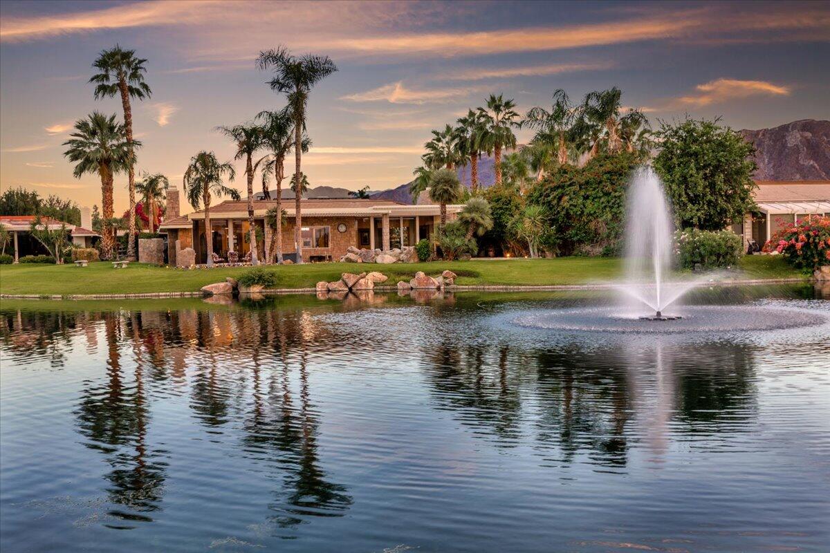 2 Deerfield Court Rancho Mirage, CA 92270 - Photo 87 of 104 a view of a lake with a house swimming pool and outdoor space