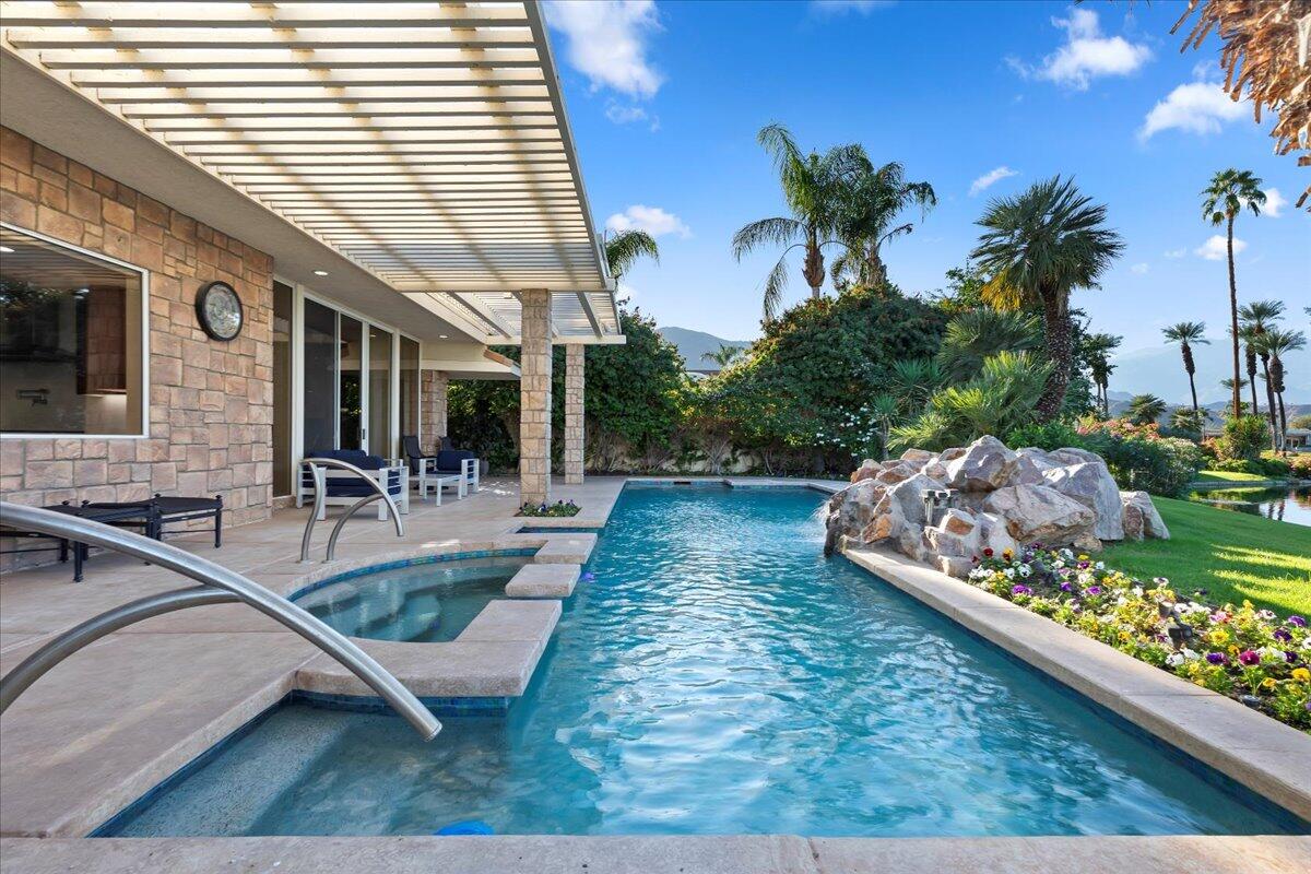 2 Deerfield Court Rancho Mirage, CA 92270 - Photo 9 of 104 a view of a house with backyard and sitting area