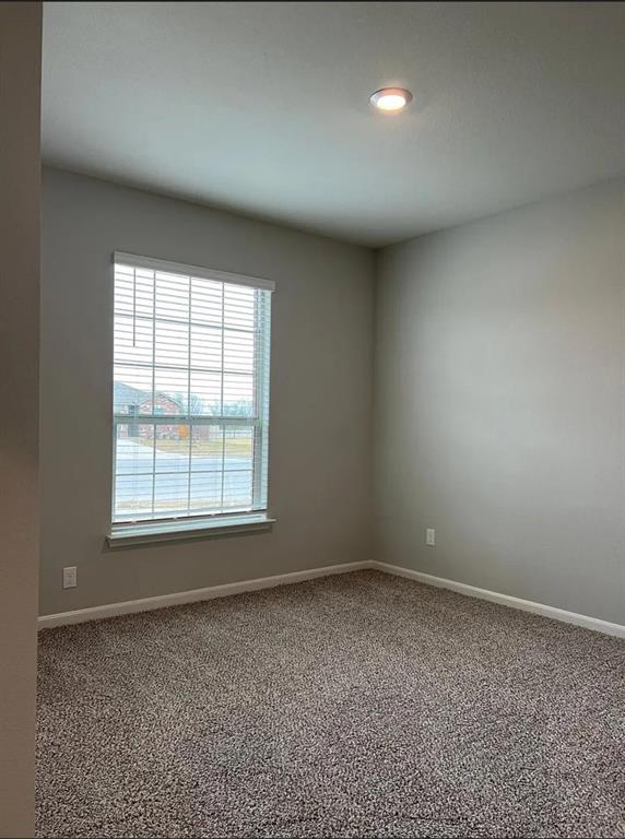 2013 Emma Court Anna, TX 75409 - Photo 16 of 20 Room featuring a recessed ceiling light, neutral paint, a window with horizontal blinds, white baseboards, and patterned carpet flooring