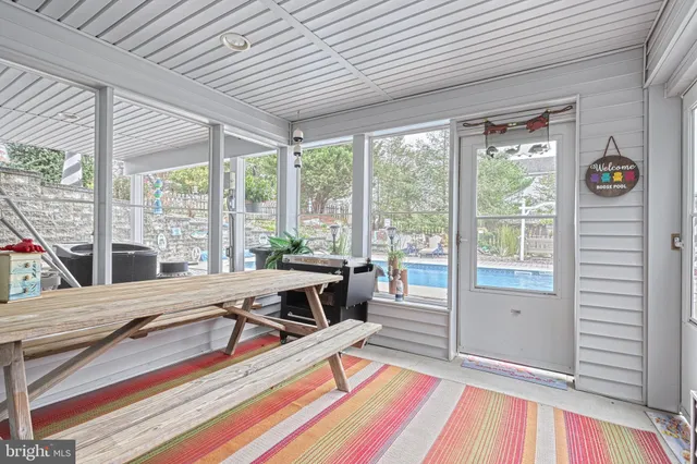 a living room filled with furniture hardwood floor and a table