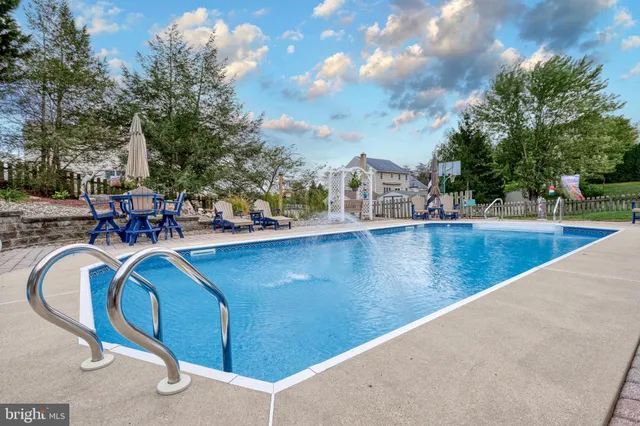 a view of a house with swimming pool
