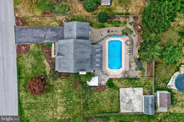 an aerial view of a house with outdoor space