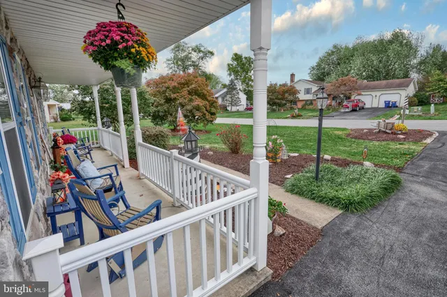 a view of a balcony with flower garden
