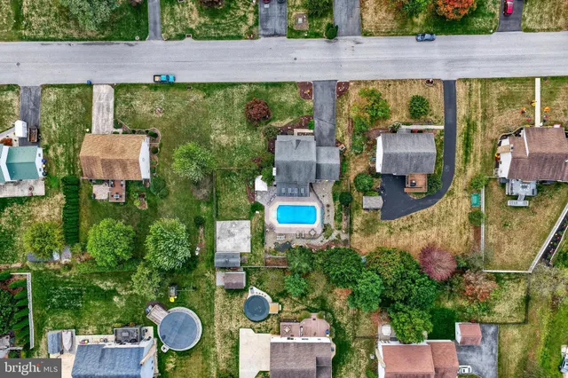 a aerial view of a house with a swimming pool