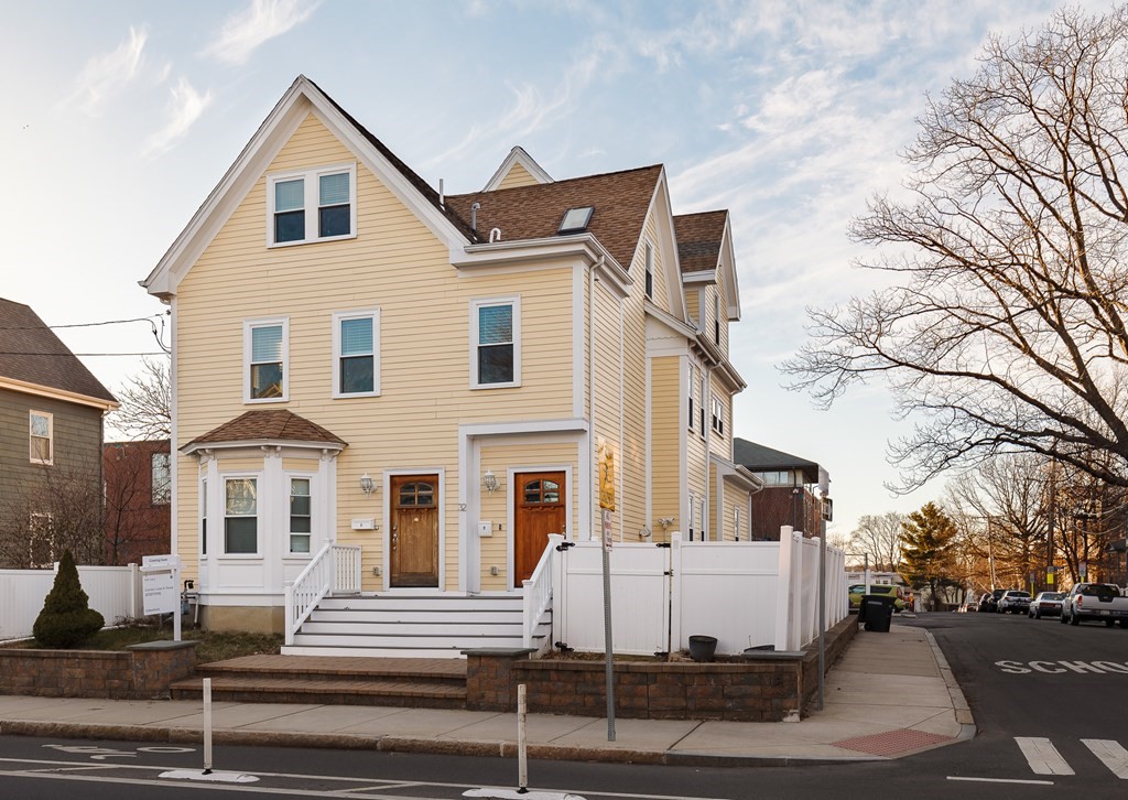 32 Cedar Street, Unit 2 Somerville, MA 02143 - Photo 1 of 20 a view of a white house with a street