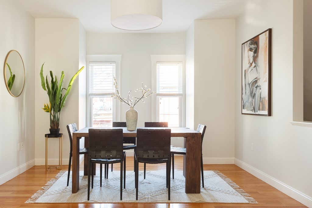 32 Cedar Street, Unit 2 Somerville, MA 02143 - Photo 12 of 20 a view of a dining room with furniture window and wooden floor
