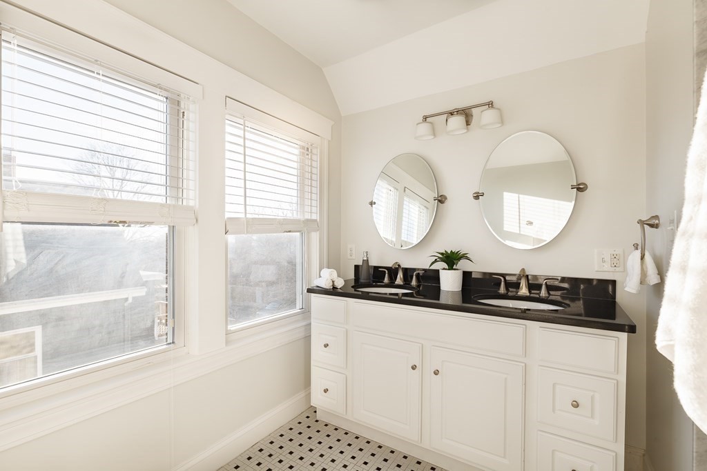 32 Cedar Street, Unit 2 Somerville, MA 02143 - Photo 17 of 20 a bathroom with a double vanity sink and a mirror