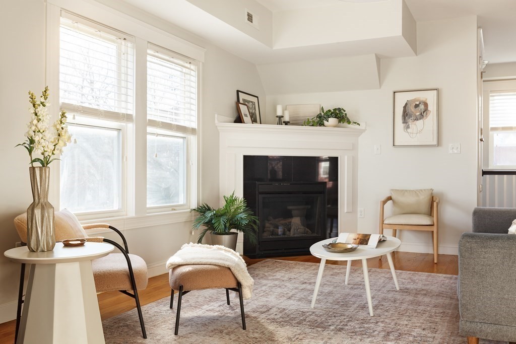 32 Cedar Street, Unit 2 Somerville, MA 02143 - Photo 4 of 20 a living room with furniture fireplace and window