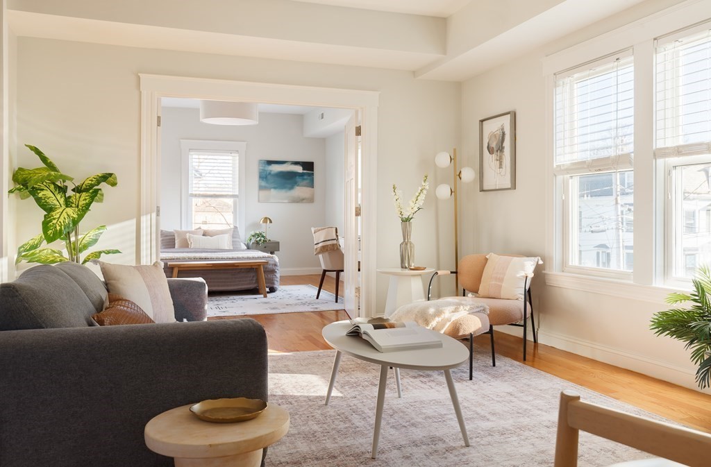 32 Cedar Street, Unit 2 Somerville, MA 02143 - Photo 6 of 20 a living room with furniture and a large window