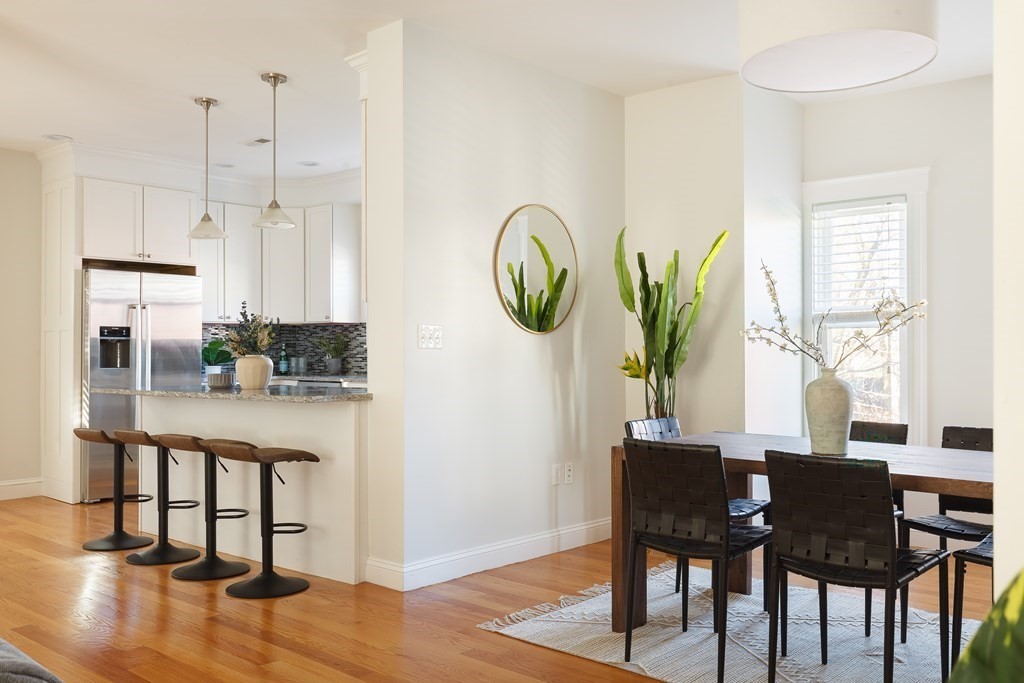 32 Cedar Street, Unit 2 Somerville, MA 02143 - Photo 7 of 20 a dining room with furniture a window and wooden floor