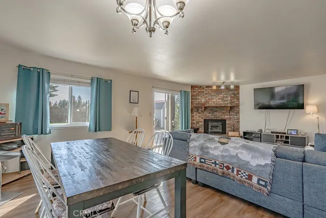 a living room with fireplace furniture and a flat screen tv