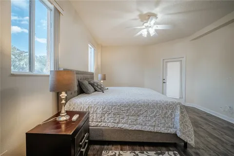 a bedroom with a bed and a lamp