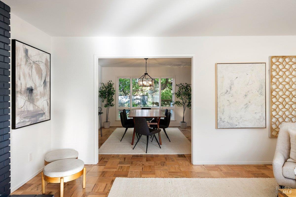 116 Twelveoak Hill Drive San Rafael, CA 94903 - Photo 27 of 93 a dining room with furniture a rug and wooden floor