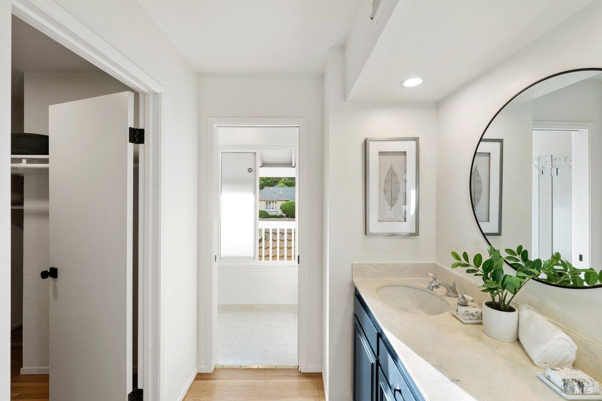 116 Twelveoak Hill Drive San Rafael, CA 94903 - Photo 77 of 93 a bathroom with a granite countertop sink a mirror and a shower