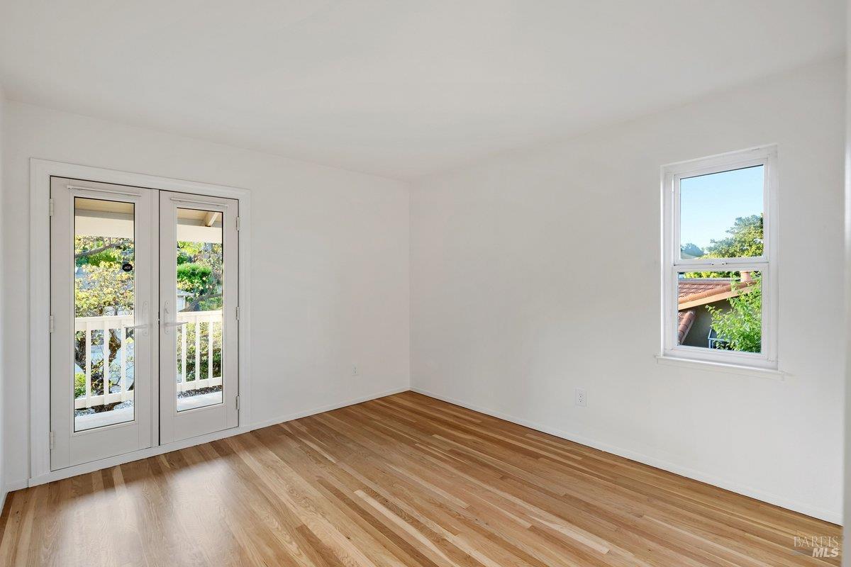 116 Twelveoak Hill Drive San Rafael, CA 94903 - Photo 81 of 93 a view of an empty room with wooden floor and a window