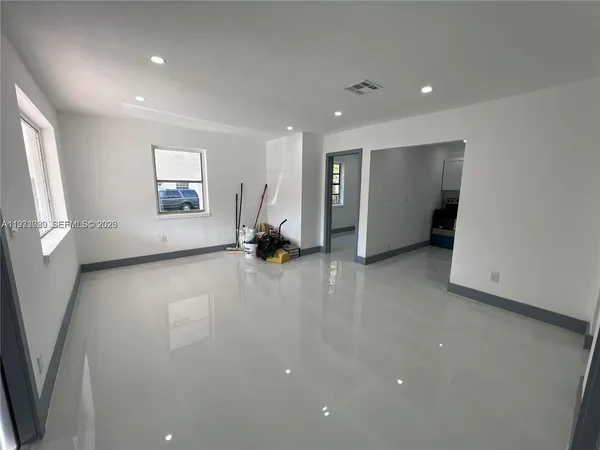 a view of empty room with large window