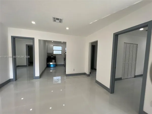 a kitchen with stainless steel appliances a refrigerator sink and stove