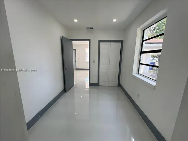 a bathroom with a shower a toilet and sink