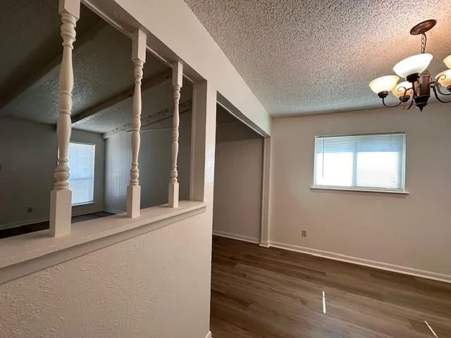 an entryway of a house with wooden floor