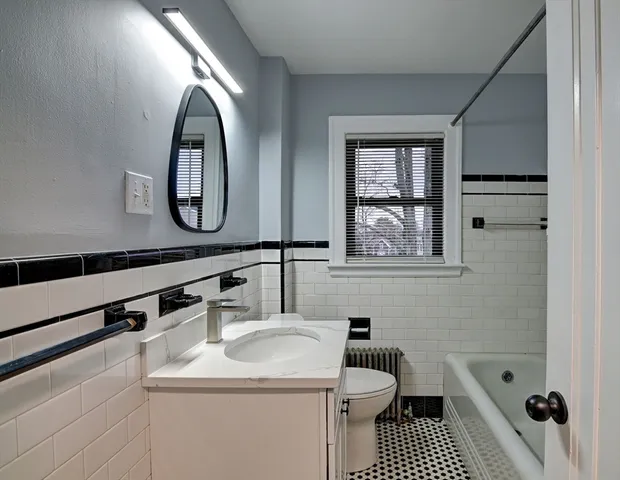 a bathroom with a sink and a bathtub