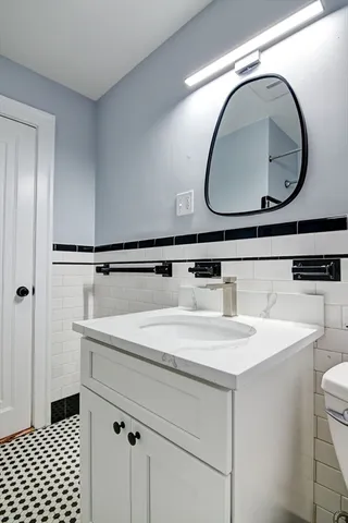 a bathroom with a sink and a mirror