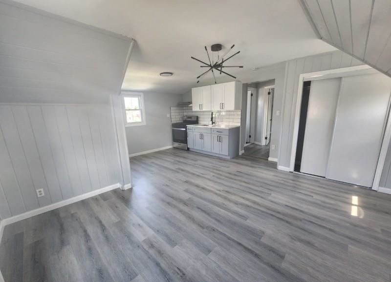 123 Prospect Street, Unit 2 Roselle, NJ 07203 - Photo 7 of 9 a view of a kitchen with wooden floor and a sink