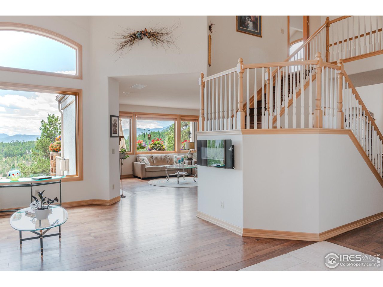 2964 Elk View Drive Evergreen, CO 80439 - Photo 16 of 40 a living room with furniture and a wooden floor
